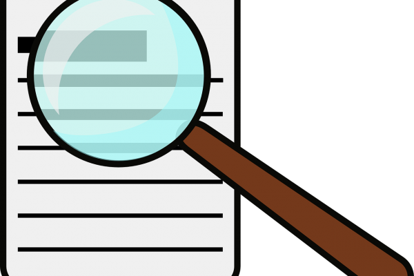 Magnifying glass over paper